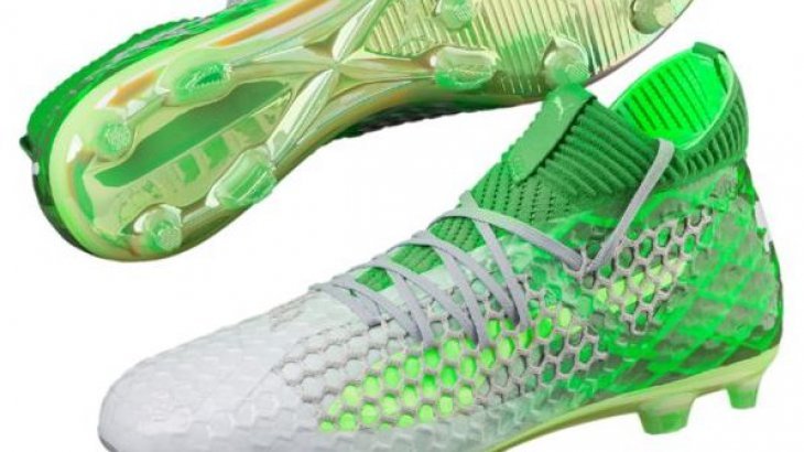 Green football shoes by Puma. 