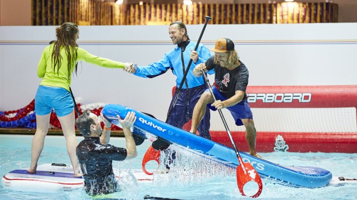 Flip it up in the air! If there's no big wave for stand up paddling at ISPO MUNICH you simply create one by hand.